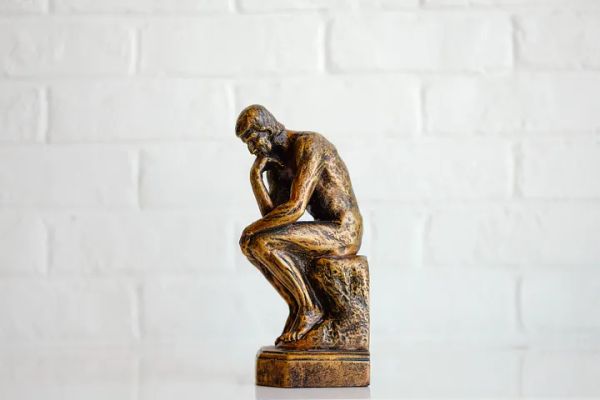 A small bronze replica of the Thinker statue